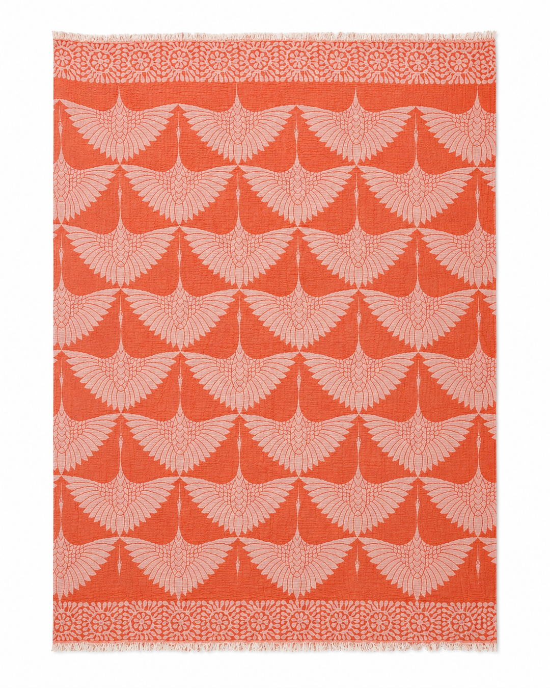 Crafted from luxurious Turkish muslin cotton, the Crane Muslin Throw Blanket Natural Border–Reversible Turkish Cotton by turkanhome.com features a square design adorned with a repeating pattern of stylized light pink birds with outstretched wings on an orange background, framed by an elegant floral border. This throw blanket combines comfort and sophistication for any setting.