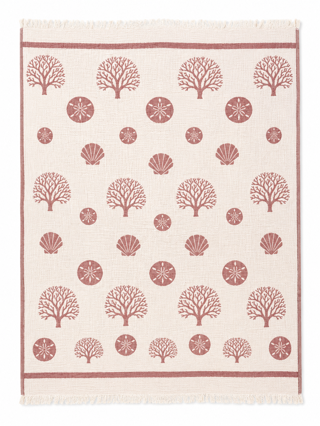 The Coastal Muslin Throw Blanket – Reversible Turkish Cotton from turkanhome.com is a rectangular beige coastal throw adorned with neat rows of red coral, seashell, and sand dollar patterns, framed by coordinating coral motifs and finished with fringe on the short edges.