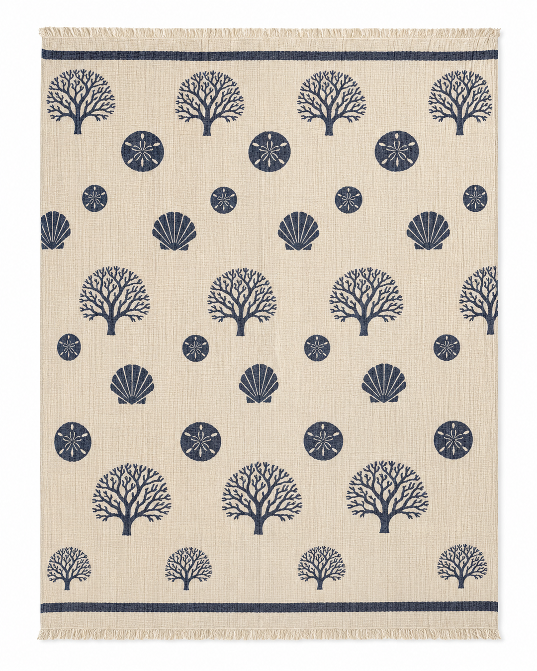 Sure! Here’s the revised sentence using the provided product data: The Coastal Muslin Throw Blanket – Reversible Turkish Cotton from turkanhome.com features a beige base adorned with evenly spaced patterns of navy blue coral, scallop shells, and sand dollars, reminiscent of a coastal motif; finished with fringed edges on the shorter sides.
