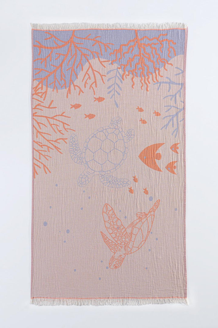 The Reef and Turtle Towel by turkanhome.com is a rectangular, 100% cotton towel with quick-drying features. It showcases sea turtles, orange coral, and small fish in soft hues on beige, finished with short white fringe on the edges.