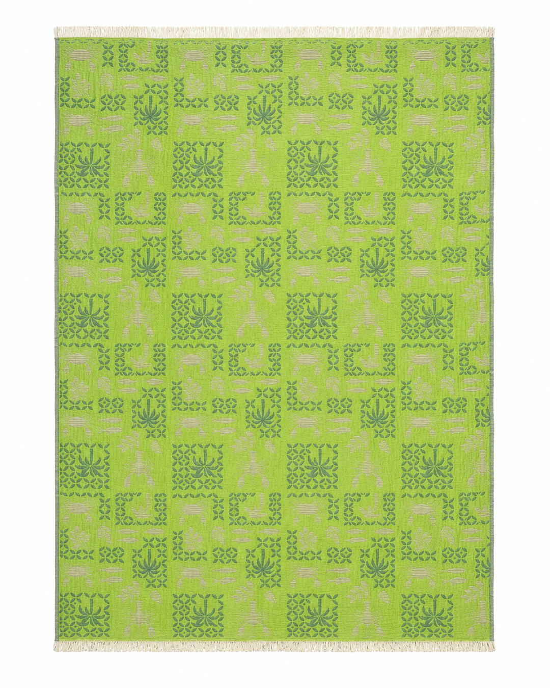 A rectangular Sea Life Muslin Throw Blanket by turkanhome.com, crafted from reversible Turkish cotton, features a symmetrical pattern of darker green leaf and square motifs on a green background with light fringe along the shorter edges. The design repeats evenly across the surface, making it a perfect addition to coastal home décor.