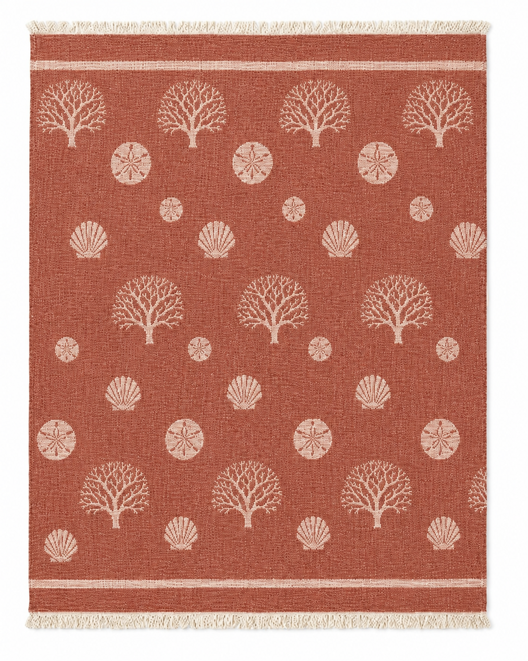 Wrap yourself in the Coastal Muslin Throw Blanket – Reversible Turkish Cotton from turkanhome.com, featuring a rectangular rust-colored design with light tan tree, shell, and sand dollar motifs, fringe on the short edges, and two parallel lines near each end—crafted from soft Turkish muslin cotton for a cozy beach blanket feel.