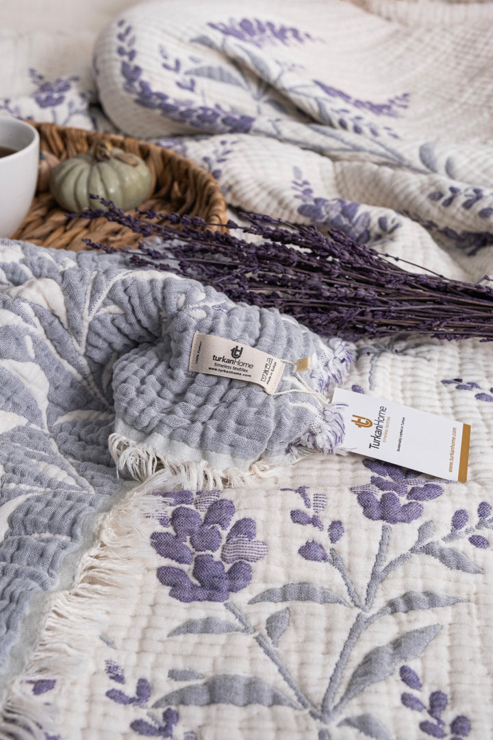 Close-up of the purple floral muslin quilt and TurkanHome label