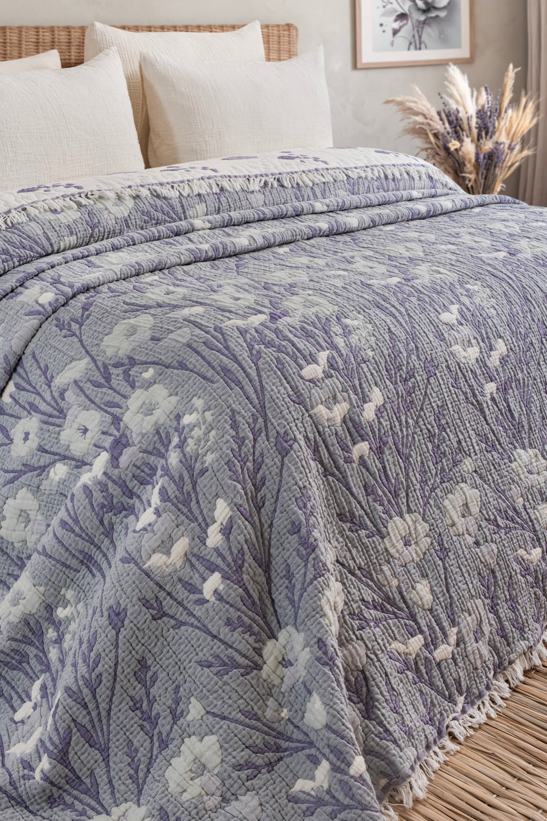Purple and white floral quilt folded to show the reverse side